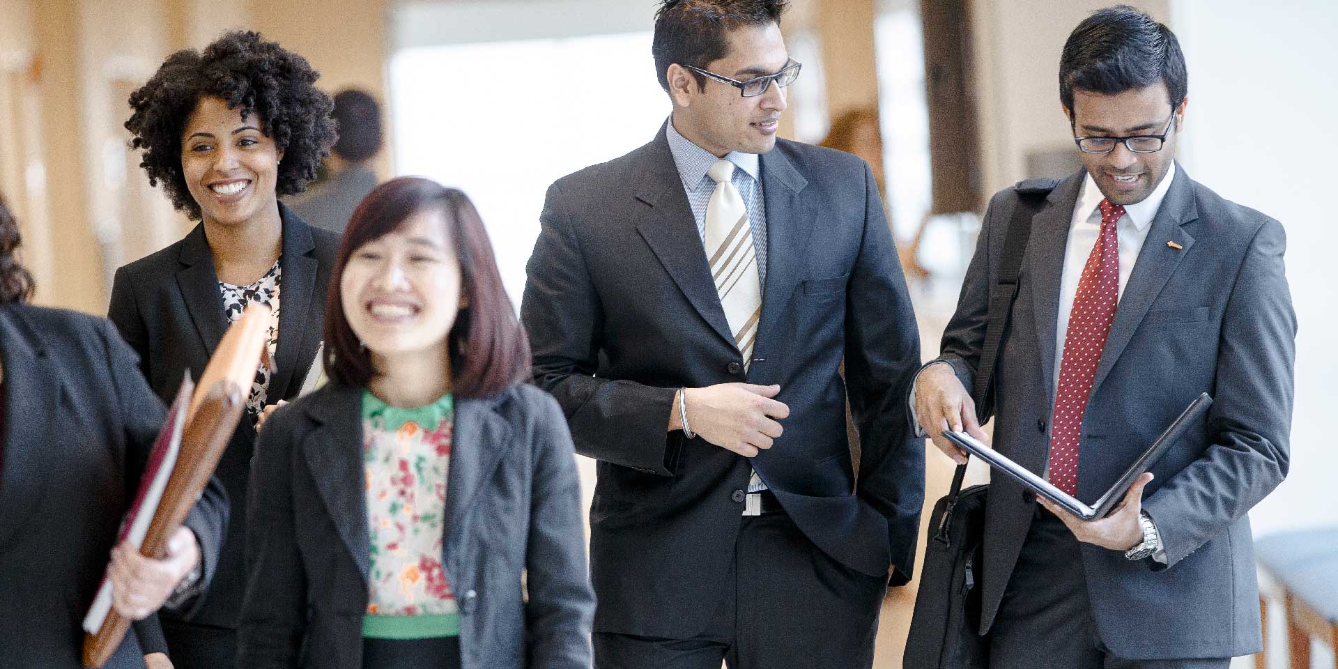 UT Dallas mba students walking in the Jindal School, Online MBA Conference