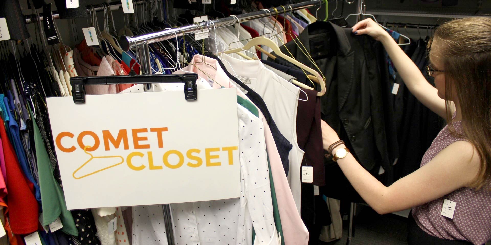 Jindal School student selecting professional clothes from the Comet Closet