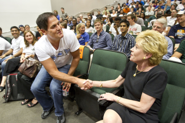 Diane McNulty shaking hands with Mark Cuban.