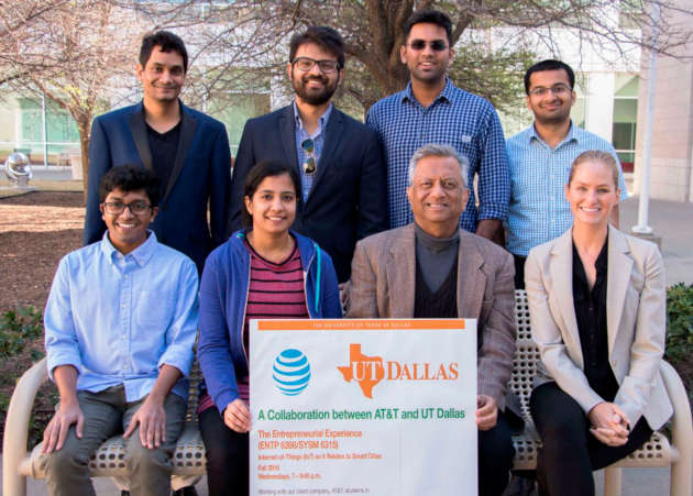 Rajiv Shah with Entrepreneurial Experience students sitting behind a AT&T and UT Dallas sign.