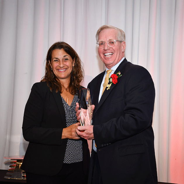 Cheryl Yawman, who won St. John Fisher’s Accounting Alumnus of the Year Award in 2013, presented the 2024 award to John Barden. (Photo is courtesy of St. John Fisher University)