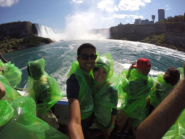 Michelle Abuda and her fiancé, Ravi Gattamaraju, try to stay dry at Niagara Falls