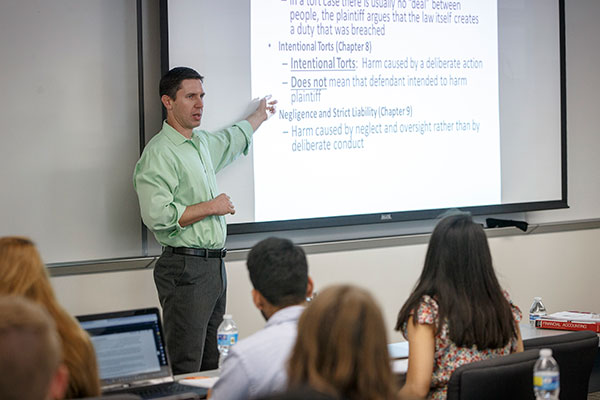program director Professor Matt Polze teaching a DMHP class in business law