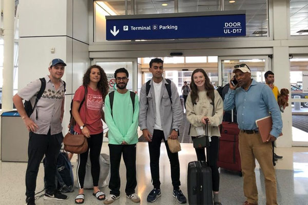 global business students at airport