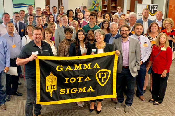 Jindal School Gamma Iota Sigma event with students and employers