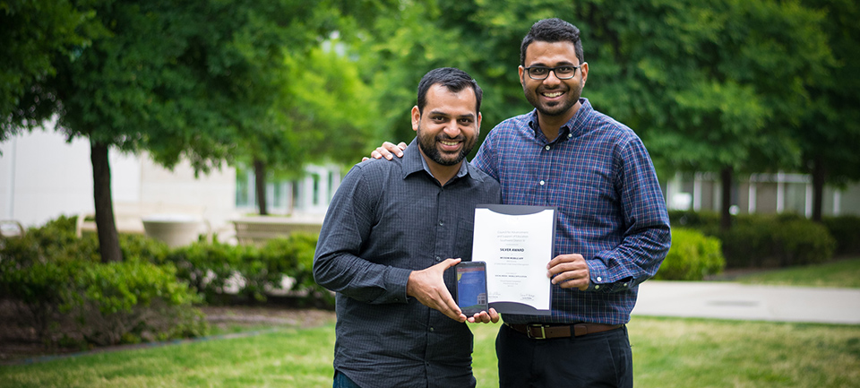 Vivek Arora and Nitin Grover with Case Award for MyJSOM Mobile App
