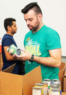 first-alumni-day-of-service-draws-volunteers-to-north-texas-food-bank-cody-meyers