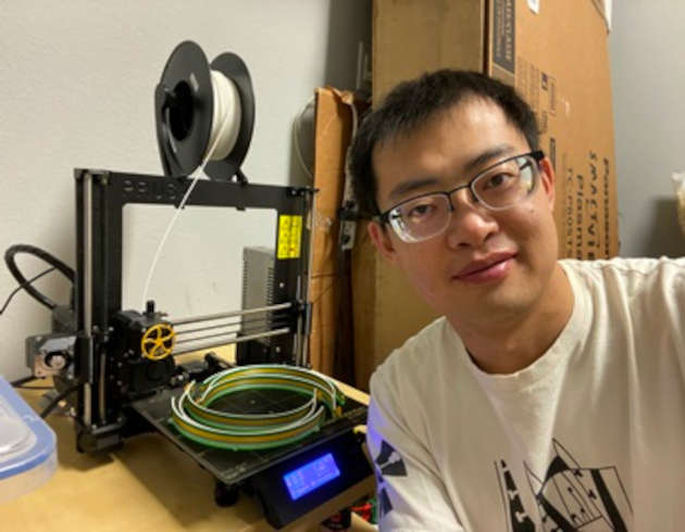 Bin Hu with his 3D printer