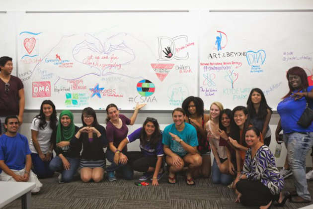 Julie Haworth with her students in front of a white board before Texas giving day.