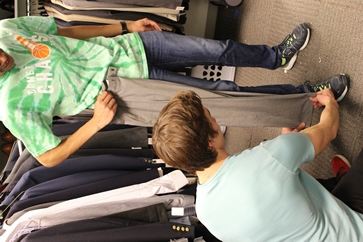 JSOM students volunteer at the Comet Closet, which provides students with attire to wear to job interviews.