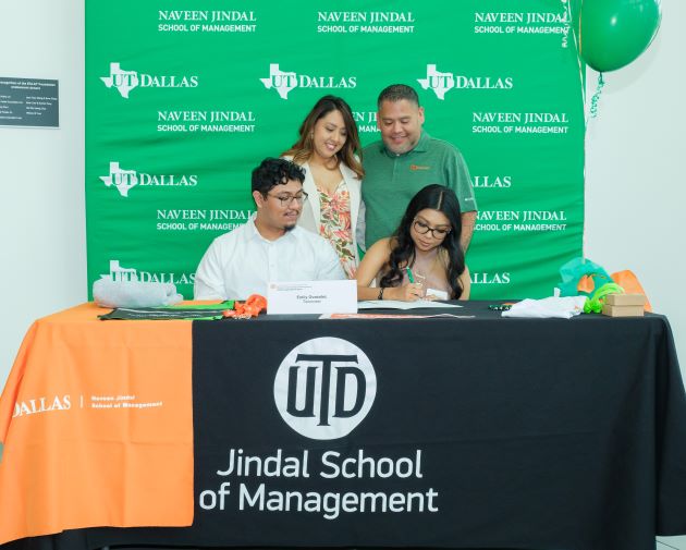 Photo of Emily Gonzalez signing her JYSP letter of intent while brother Jacob, mother Priscilla and father Ricardo look on.