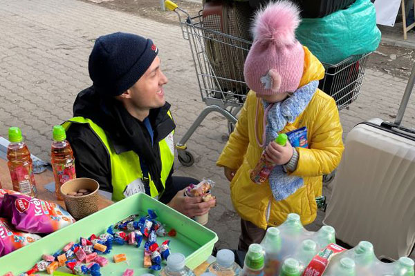Vlad Wallace feeding refugees from Ukraine.
