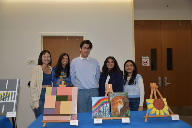 Jindal School students Zoe Nguyen, Rithika Bandla, Cesar Del La Cruz, Maham Quadri and Ria Patel serve at the Stewpot Gallery