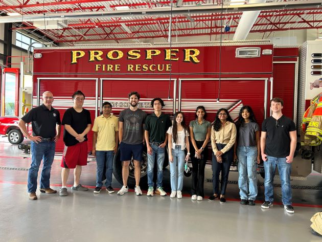 Photo of JSOM students and faculty touring the Prosper fire station.