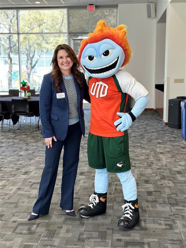 Phot of Dawn Owens with Temoc at the Fourth Annual Undergraduate Deans Conference presented by the Jindal School